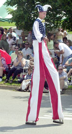 parade man in stilts